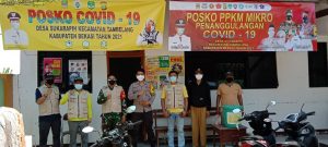 Polsek Tambelang Semprot Disinfektan di Desa Sukatenang